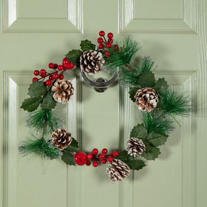 Hanging Christmas Wreath with Red Berries and Frosted Pinecones