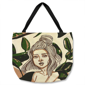 Young woman in tropical leaves Designer Tote bag