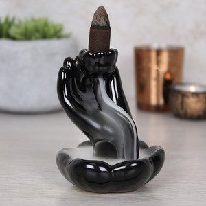 Hand and Lotus Flower Backflow Incense Burner Smoke Curls Downward