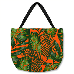 Green Tropical Leaves On Orange Tote bag