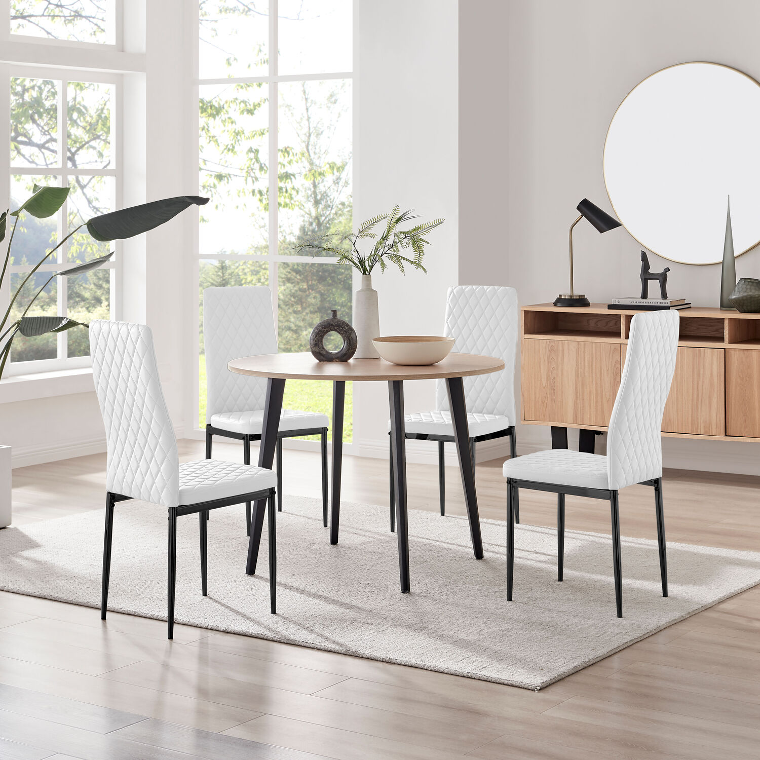 Koko Oak Effect Round Dining Table And 4 Milan Black Leg Dining Chairs