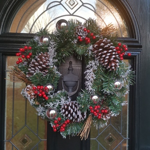Festive Silver Dressed Christmas Wreath with Pinecones and Red Berries