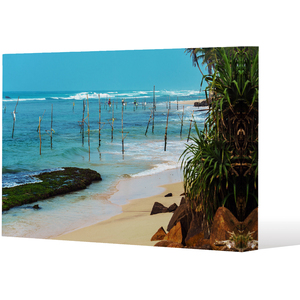 Fishermen on the ocean coast of Sri Lanka Canvas Print