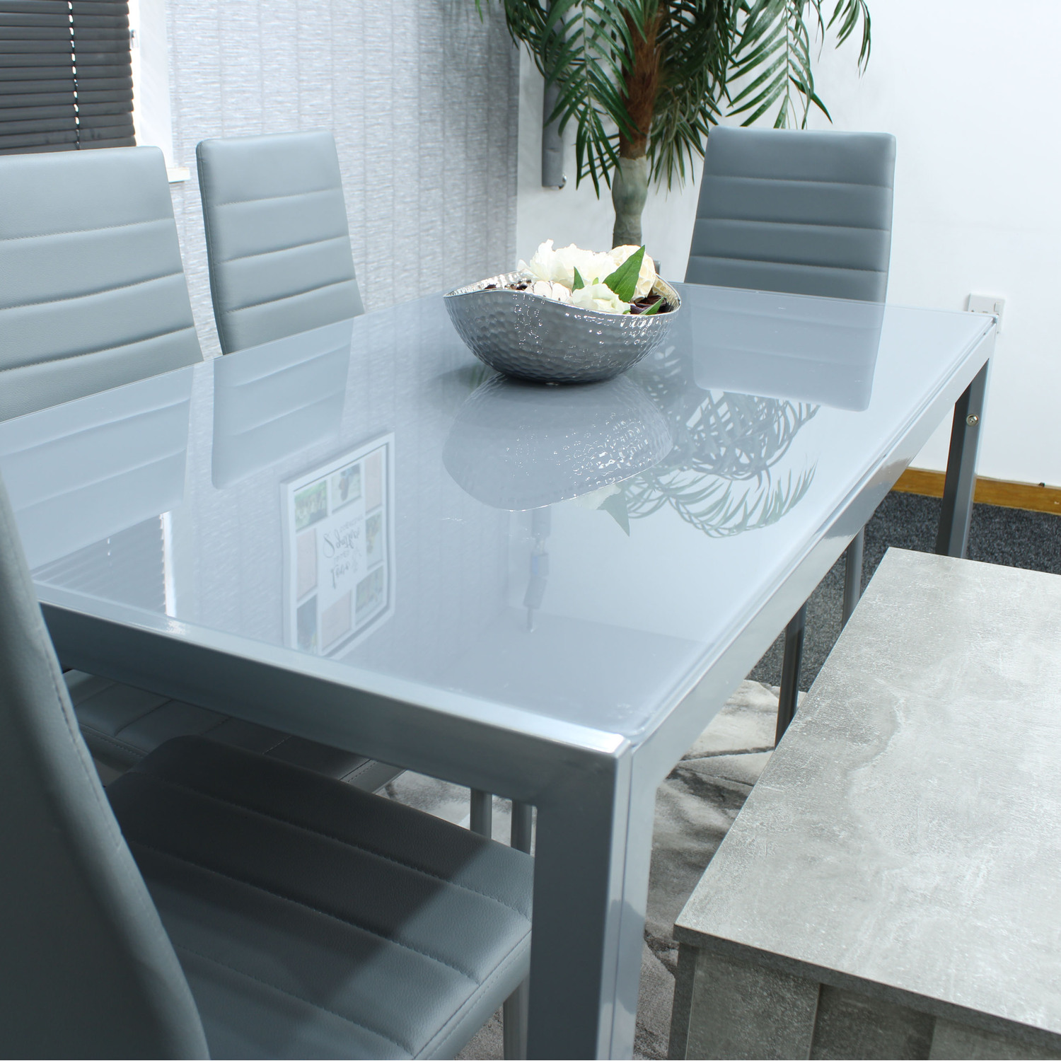 Grey Glass Table With 4 Grey Faux Leather Chairs And 1 Bench