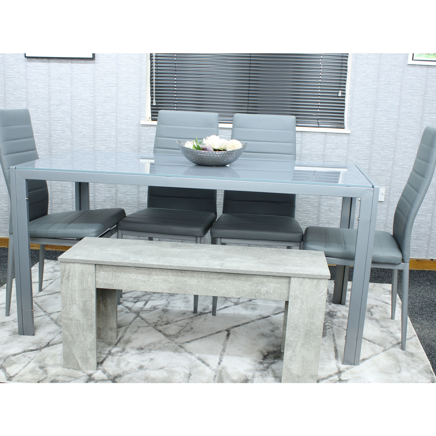 Grey Glass Table With 4 Grey Faux Leather Chairs And 1 Bench