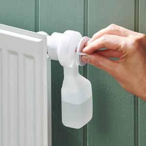 Radiator Bleeder Tool with Integrated Reservoir and Valve Key